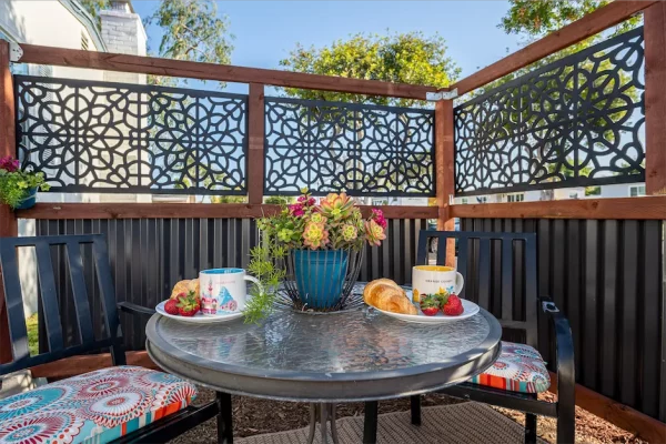 Catch the morning sun on our quaint side patio. This charming space is the perfect setting for a light breakfast and coffee, providing a peaceful and refreshing start to your day.
